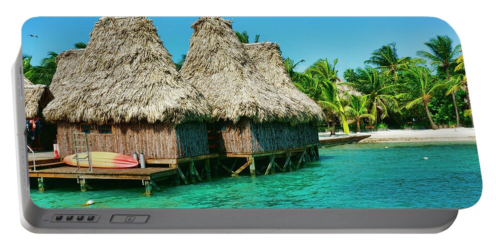 Belize Portable Battery Charger featuring the photograph Grass Huts on the water of Ambergris Caye Belize by Waterdancer