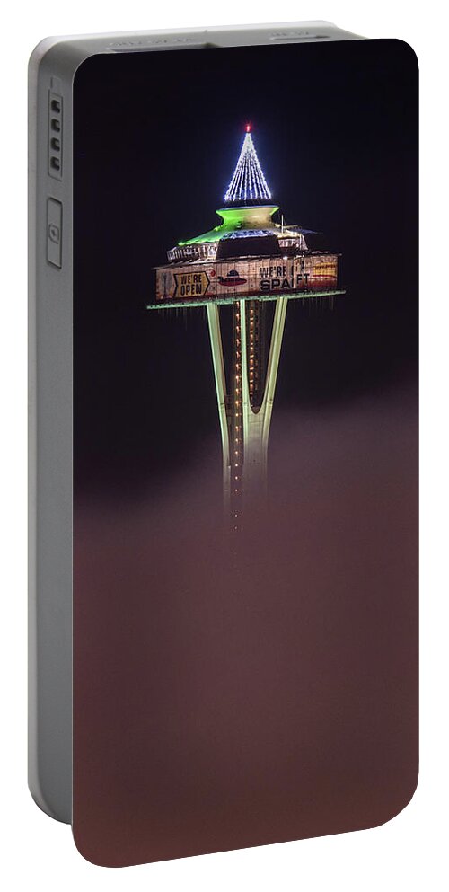 Seattle Portable Battery Charger featuring the photograph Green Space Needle Above The Fog by Matt McDonald