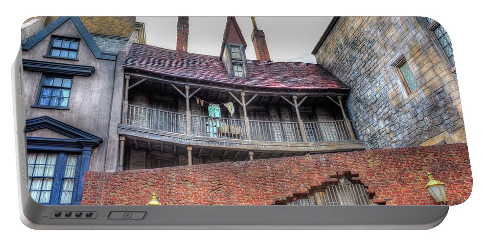 Amusement Parks Portable Battery Charger featuring the photograph Harry Potter World Architecture by Jim Thompson