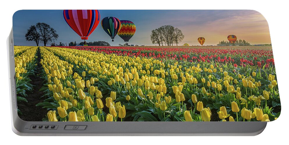 Hot Air Balloons Portable Battery Charger featuring the photograph Hot air balloons over tulip fields by William Lee