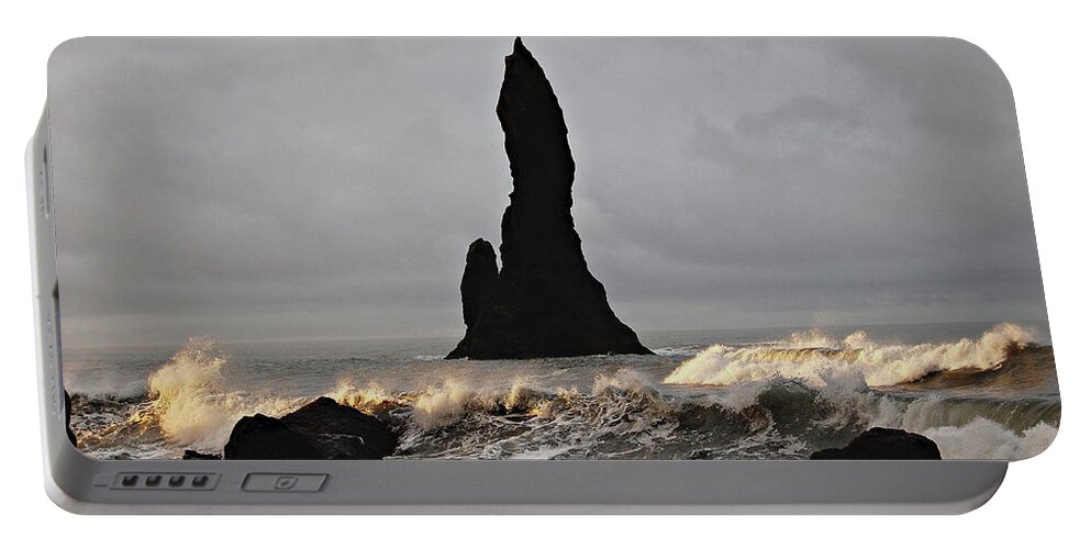 Beach Portable Battery Charger featuring the photograph Icelandic Monolith by Matt Cegelis