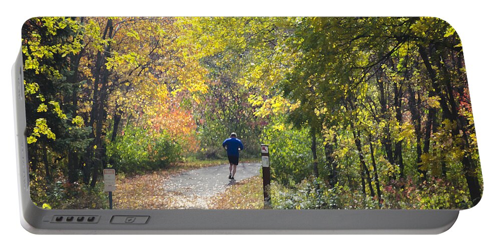Digital Portable Battery Charger featuring the photograph Jogger on Nature Trail in Autumn by Lynn Hansen