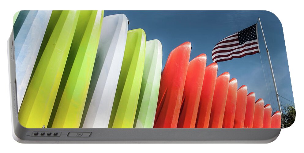 Kayaks Portable Battery Charger featuring the photograph Kayaks with Flag by John Greco