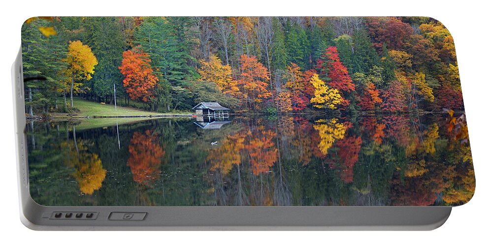 Fall Scene Portable Battery Charger featuring the photograph Lake Logan Boathouse in Fall by Mike McGlothlen