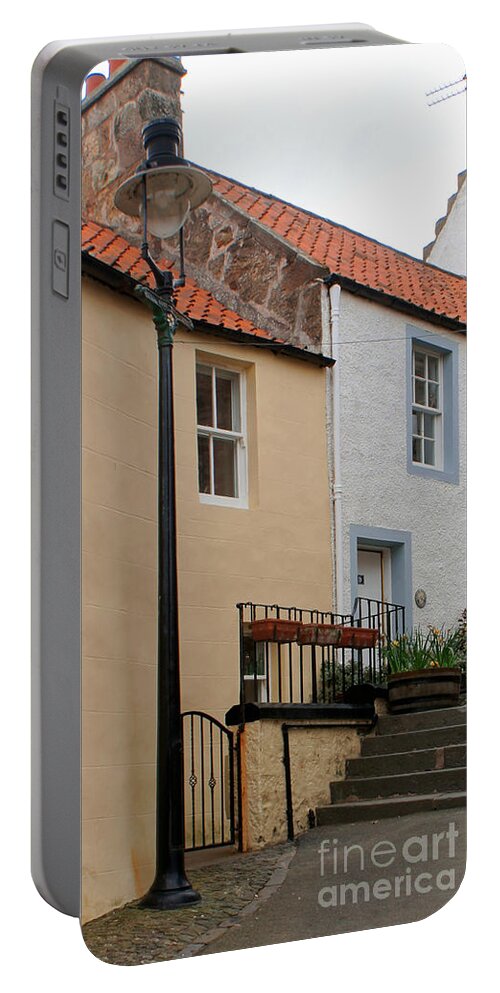 Lamppost Portable Battery Charger featuring the photograph Lamppost on narrow street by Elena Perelman