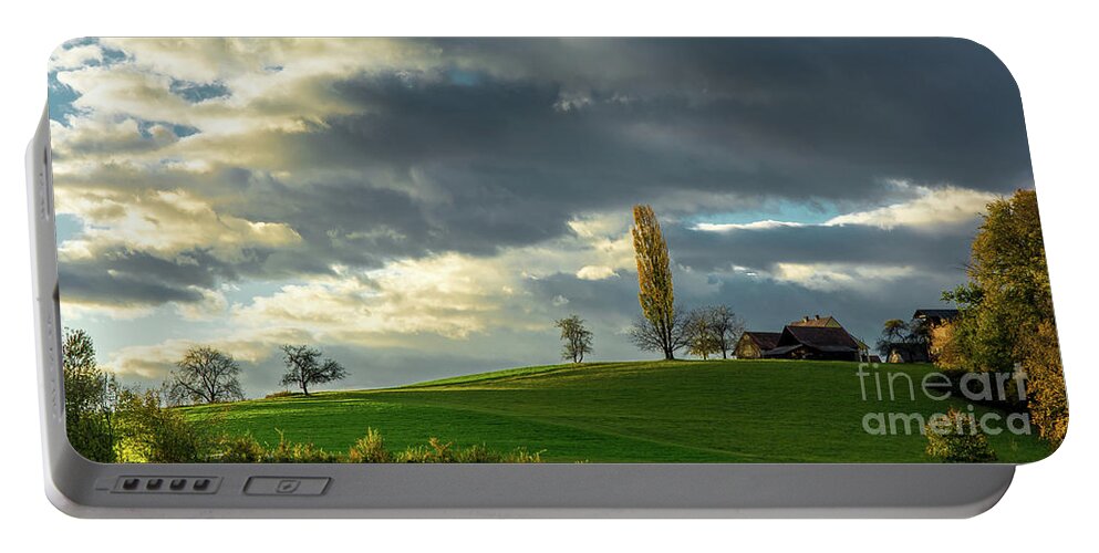 Landscape Portable Battery Charger featuring the photograph Landscape With House and Sunlit Hill in Austria by Andreas Berthold