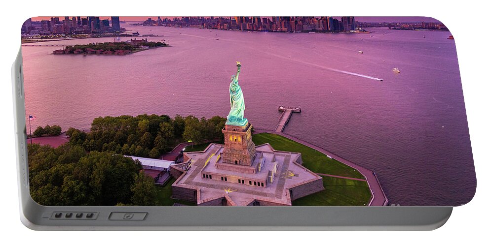 America Portable Battery Charger featuring the photograph Liberty Island Twilight by Inge Johnsson