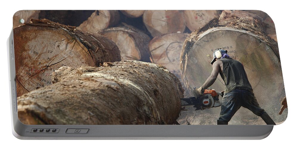Mp Portable Battery Charger featuring the photograph Logger Cutting Tree Trunk, Cameroon by Cyril Ruoso