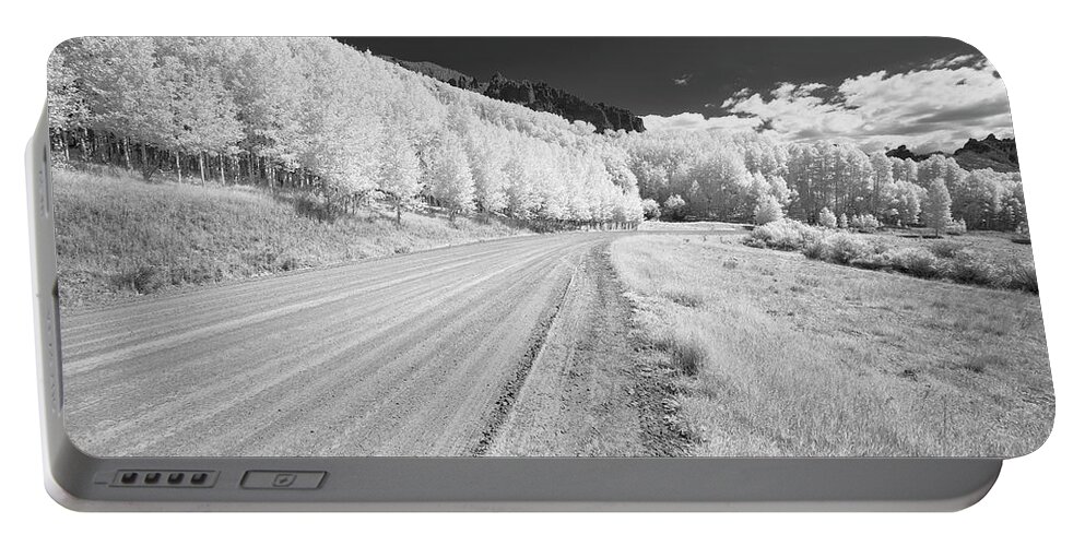 Art Portable Battery Charger featuring the photograph Long Road in Colorado by Jon Glaser