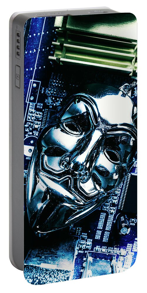 Cyber Portable Battery Charger featuring the photograph Metal anonymous mask on motherboard by Jorgo Photography