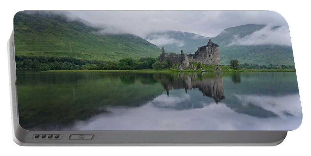 Kilchurn Castle Portable Battery Charger featuring the photograph Mist swarms around Kilchurn Castle by Stephen Taylor