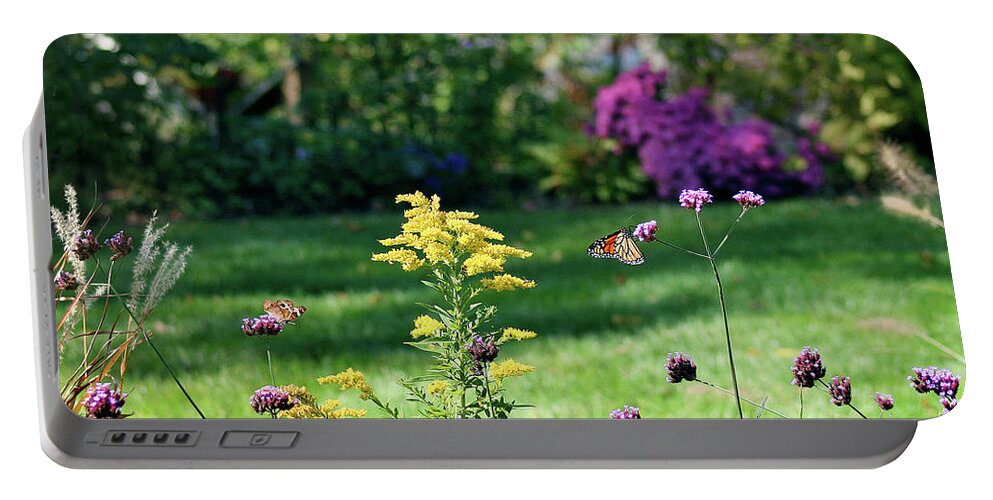 Monarch Portable Battery Charger featuring the photograph Monarch and Buckeye Butterflies 2011 by Karen Adams