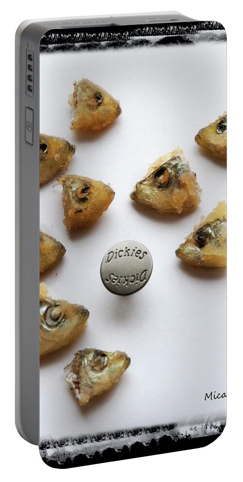 Nine Portable Battery Charger featuring the photograph Nine trunked fish heads and one button by Micah Offman