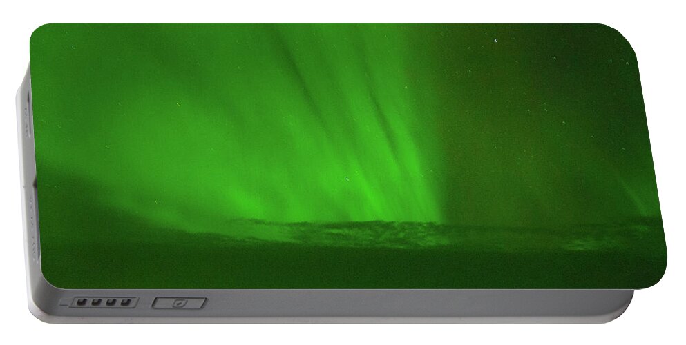 Northern Lights Portable Battery Charger featuring the photograph Northern Lights Over the North Atlantic by Allan Levin