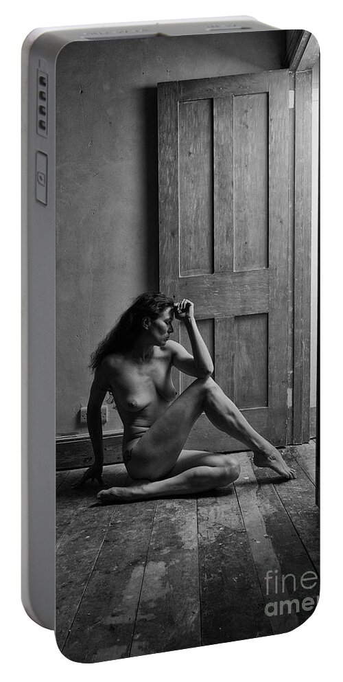 Woman Portable Battery Charger featuring the photograph Nude woman sitting by doorway in abandoned room by Clayton Bastiani