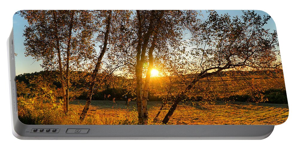 Sun Portable Battery Charger featuring the photograph October Sunset golden glow by Lilia S