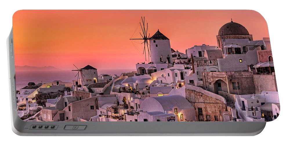 Aegean Portable Battery Charger featuring the photograph Oia Sunset in Santorini - Greece by Constantinos Iliopoulos