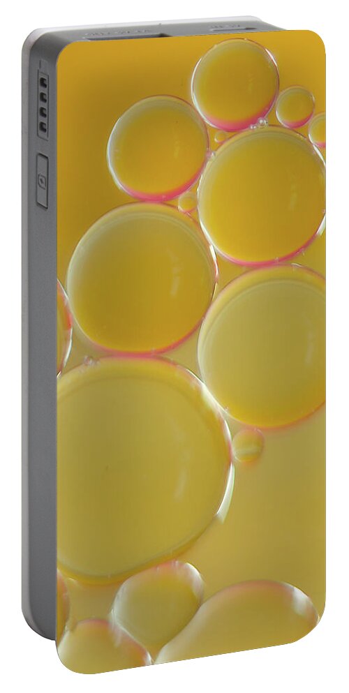 Water Portable Battery Charger featuring the photograph Oil bubbles on water abstract by Andy Myatt