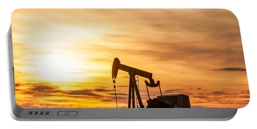 Oil Portable Battery Charger featuring the photograph Oil Stained Sky by Todd Klassy