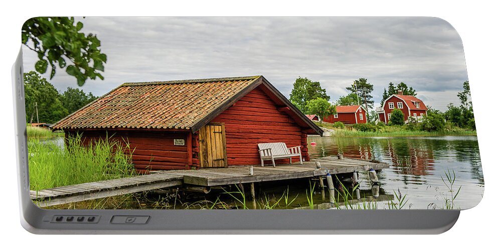 The Old Boathouse Portable Battery Charger featuring the photograph Old boathouse by Torbjorn Swenelius