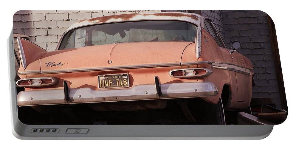 Classic Plymouth Portable Battery Charger featuring the photograph Old Faded Red Plymouth in Sunset Tones by Colleen Cornelius