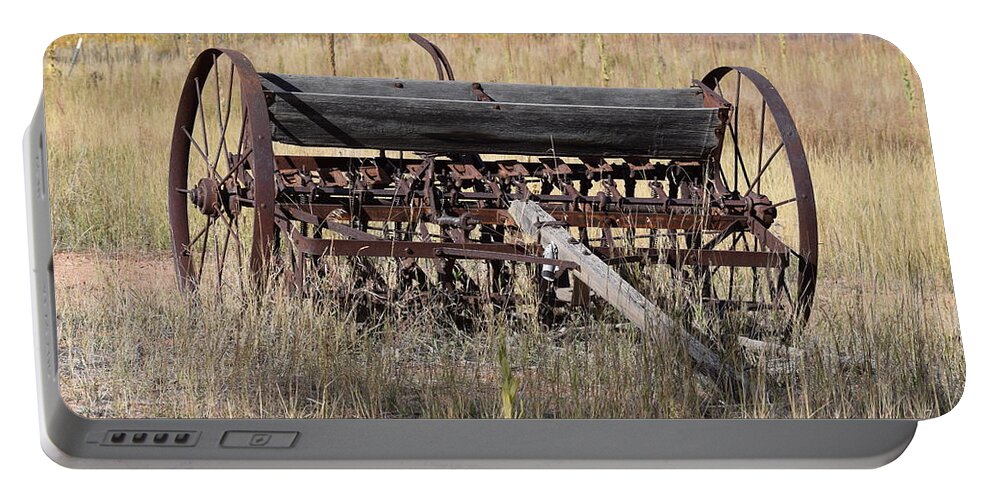 Old Portable Battery Charger featuring the photograph Farm Implament Westcliffe CO by Margarethe Binkley