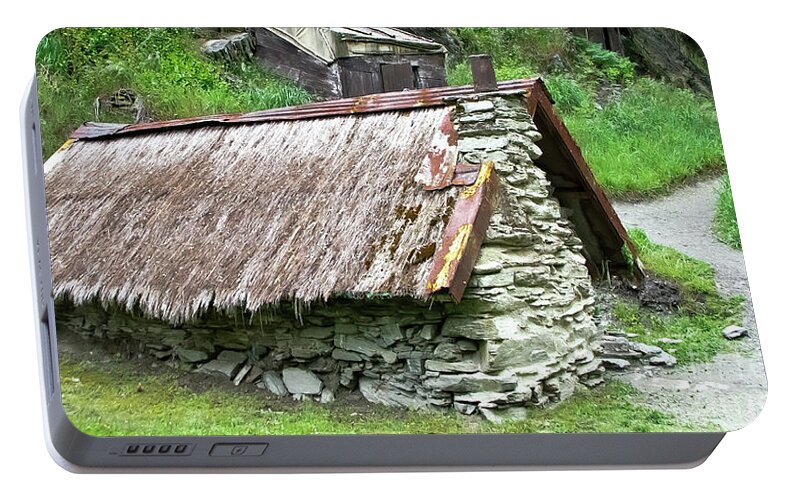Queenstown Portable Battery Charger featuring the photograph Old Hut by Yurix Sardinelly