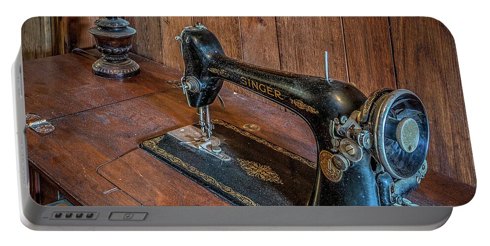 Antique Portable Battery Charger featuring the photograph Old sewing machine by Izet Kapetanovic