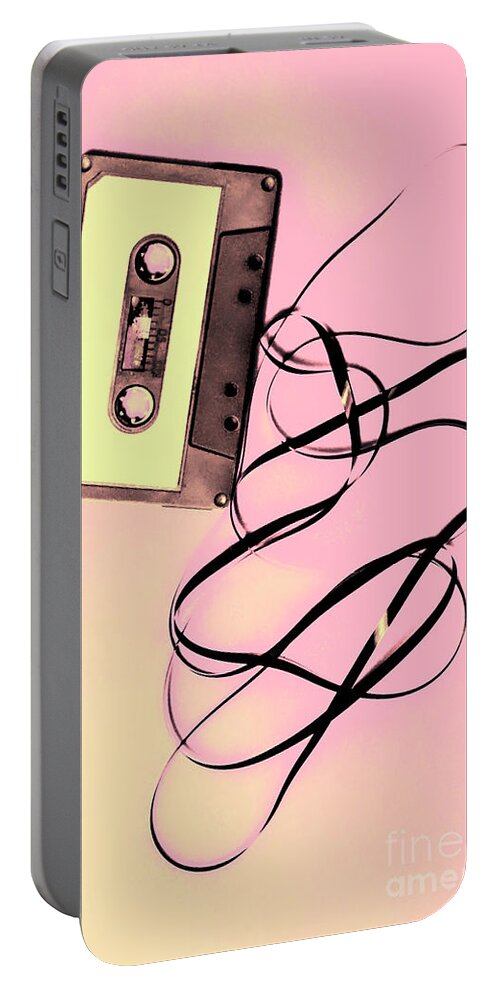 Cassette Portable Battery Charger featuring the photograph Old tape on pink background by Jorgo Photography