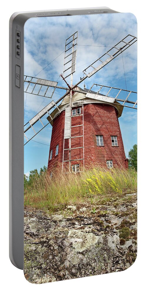 Windmill Portable Battery Charger featuring the photograph Old wooden windmill in Sweden by GoodMood Art