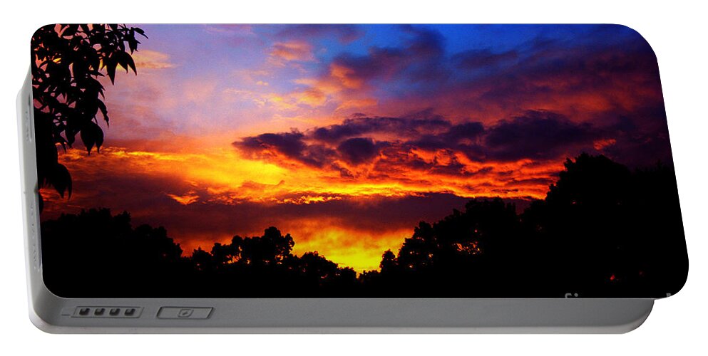 Clay Portable Battery Charger featuring the photograph Ominous Sunset by Clayton Bruster