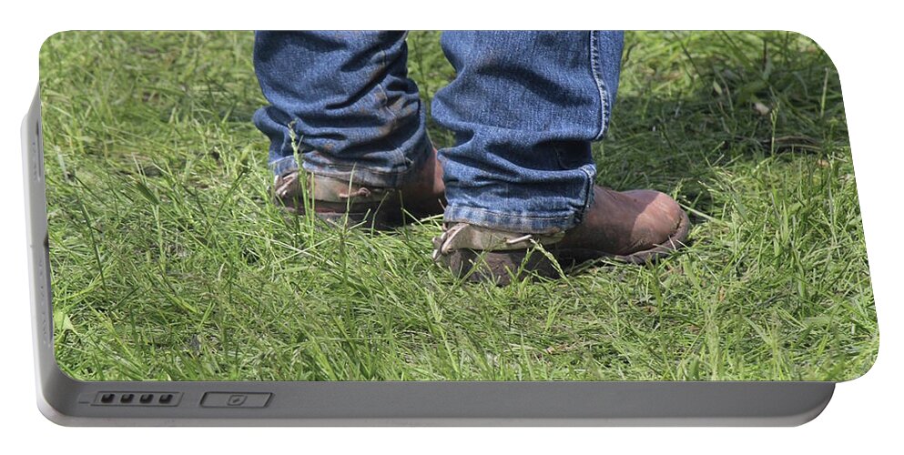 Cowboy Portable Battery Charger featuring the photograph On the Ground by Ann E Robson
