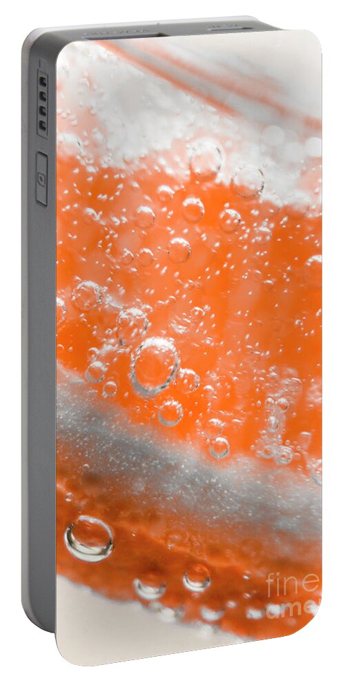 Macro Portable Battery Charger featuring the photograph Orange martini cocktail by Jorgo Photography