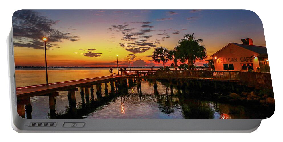 Sun Portable Battery Charger featuring the photograph Pelican Cafe Sunrise by Tom Claud