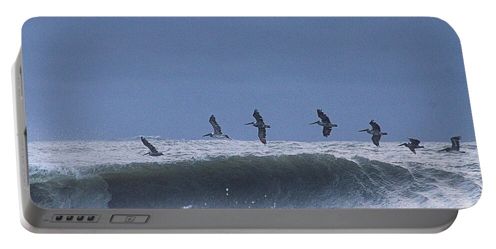 Fauna Portable Battery Charger featuring the photograph Pelicans Over A Wave by Robert Banach