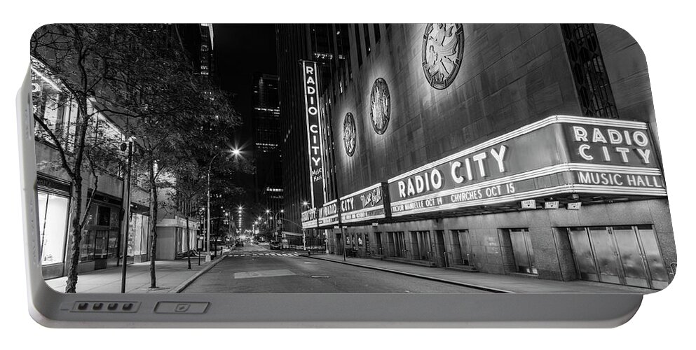 Nyc Portable Battery Charger featuring the photograph Radio City Music Hall NYC Black and White by John McGraw