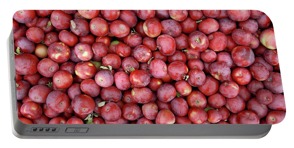 Apple Portable Battery Charger featuring the photograph Red apples background by GoodMood Art