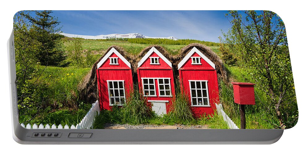 Elf Houses Portable Battery Charger featuring the photograph Red elf houses in Iceland for the Icelandic hidden people by Matthias Hauser