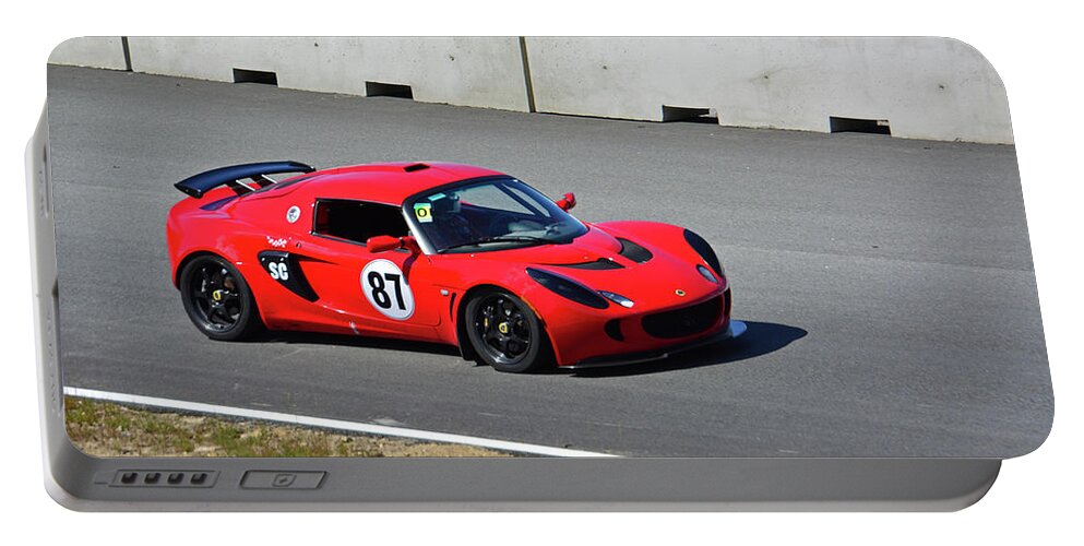 Motorsports Portable Battery Charger featuring the photograph Red Lotus 87 by Mike Martin
