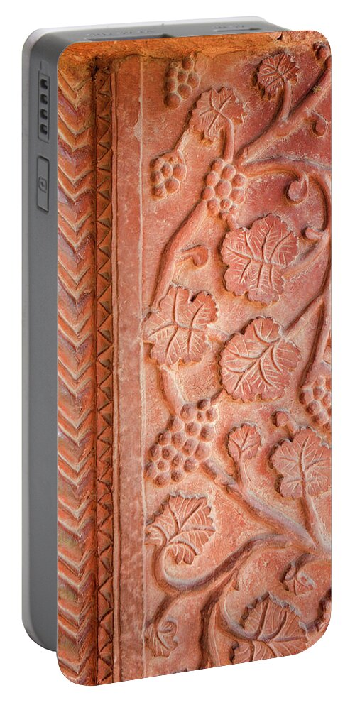 Red Portable Battery Charger featuring the photograph Red Stone Carvings in Fatehpur Sikri by Aivar Mikko