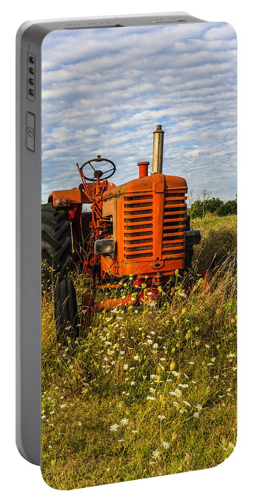 Tractor Portable Battery Charger featuring the photograph Red Tractor in a green Meadow. by John Paul Cullen