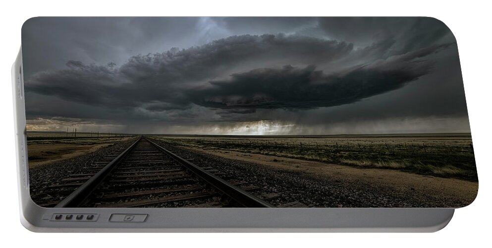 Storm Portable Battery Charger featuring the photograph Right on track by Jeff Niederstadt