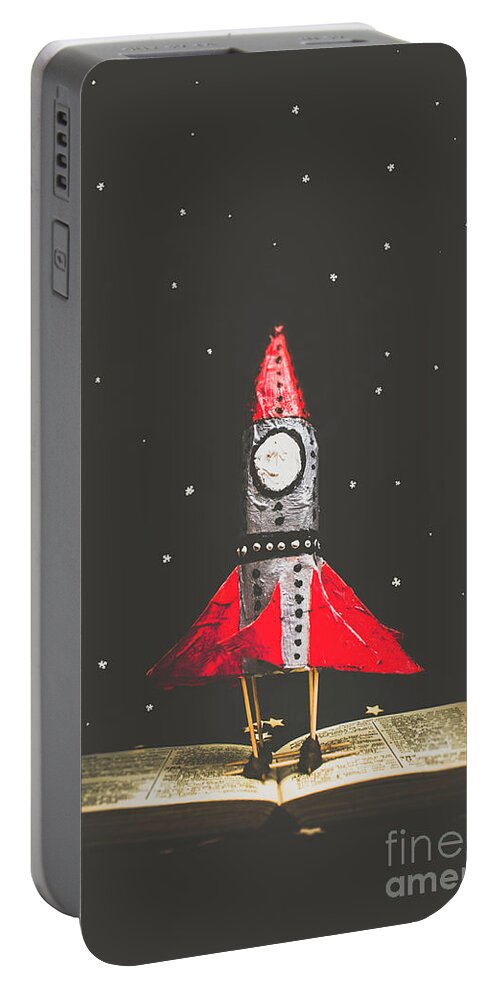 Book Portable Battery Charger featuring the photograph Rockets and cartoon puzzle star dust by Jorgo Photography