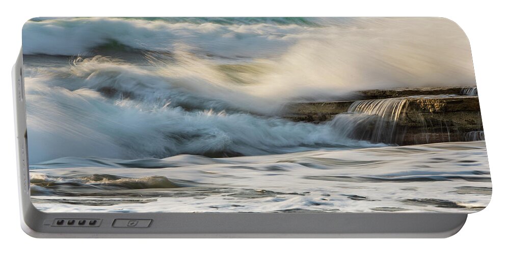 Sea Waves Portable Battery Charger featuring the photograph Rocky seashore, wavy ocean and wind waves crashing on the rocks by Michalakis Ppalis
