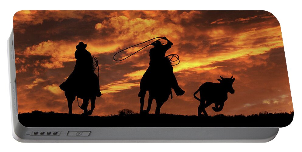 Western Portable Battery Charger featuring the photograph Roping Cowboys and Fiery Skies by Stephanie Laird