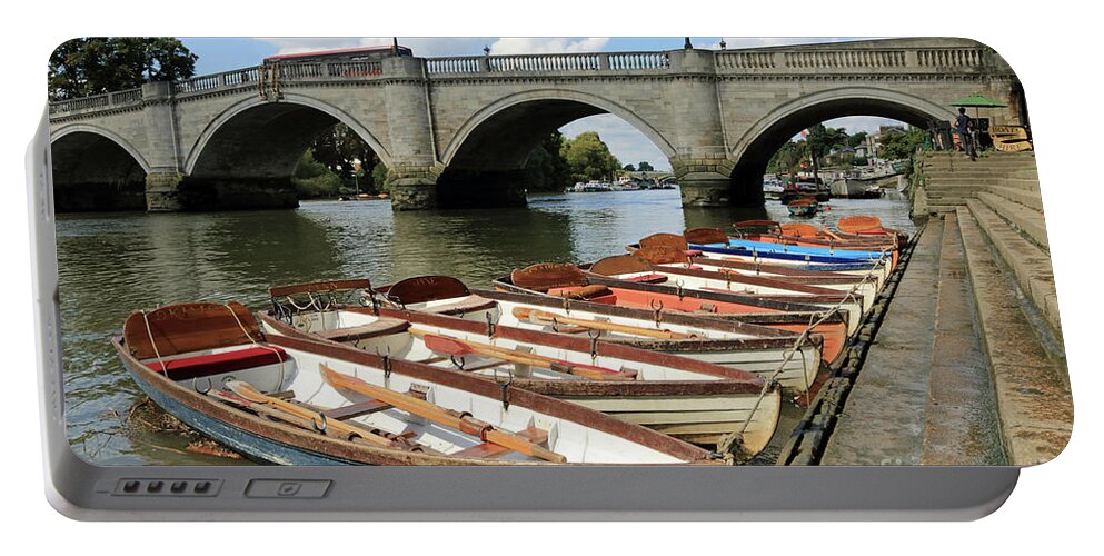 River Thames At Richmond Bridge Rowing Boats At Richmond Uk Portable Battery Charger featuring the photograph Rowing boats at Richmond Bridge UK by Julia Gavin
