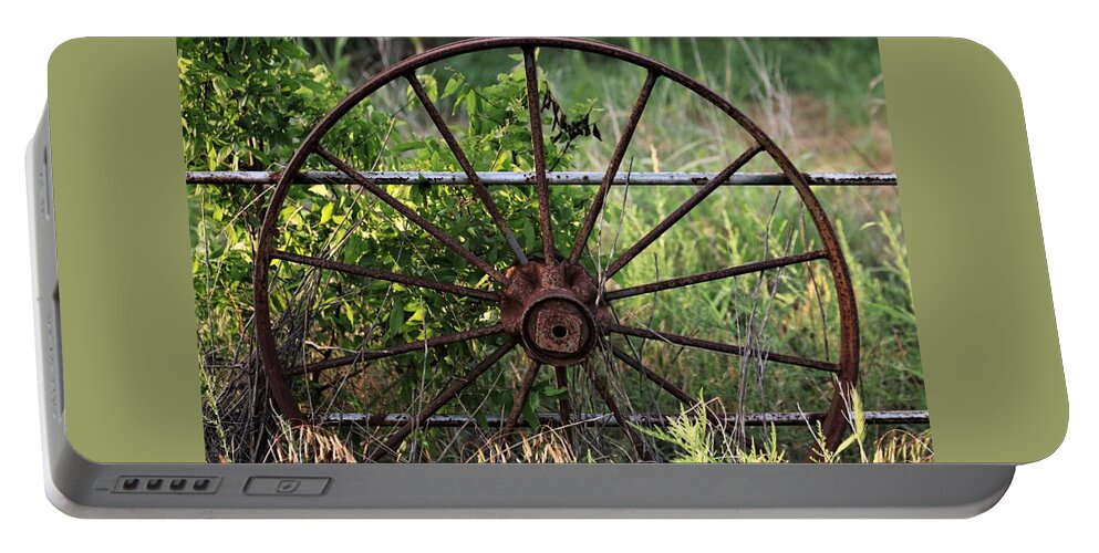 Objects Portable Battery Charger featuring the photograph Rusty Wagon Wheel on Fence by Sheila Brown