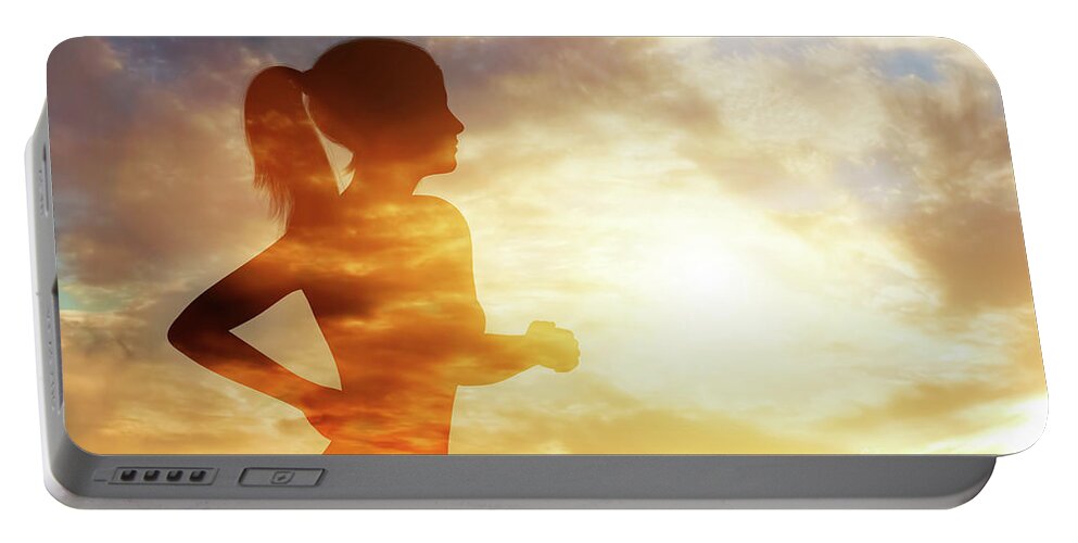 Woman Portable Battery Charger featuring the photograph Silhouette of a running woman on sky background. by Michal Bednarek