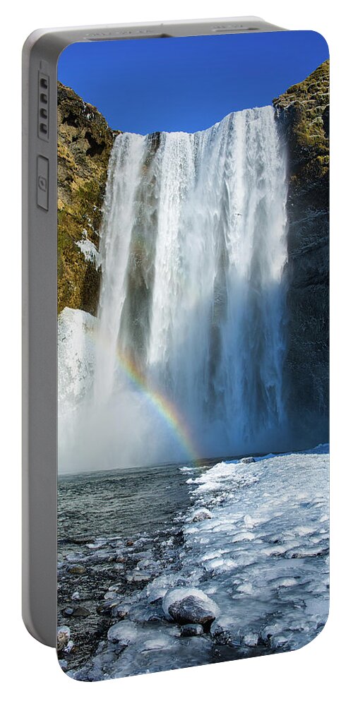 Skogafoss Portable Battery Charger featuring the photograph Skogafoss waterfall Iceland in winter by Matthias Hauser