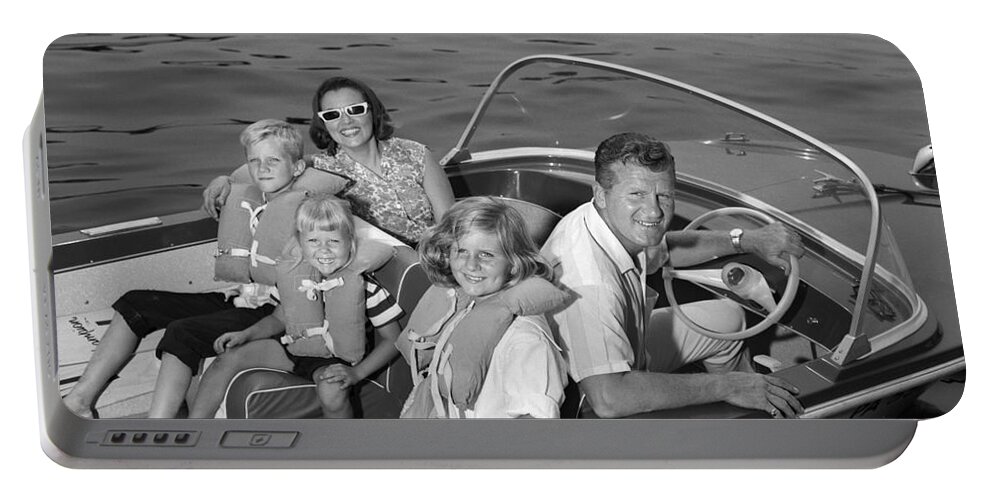 1960s Portable Battery Charger featuring the photograph Smiling Family In Docked Boat, C.1960s by H. Armstrong Roberts/ClassicStock